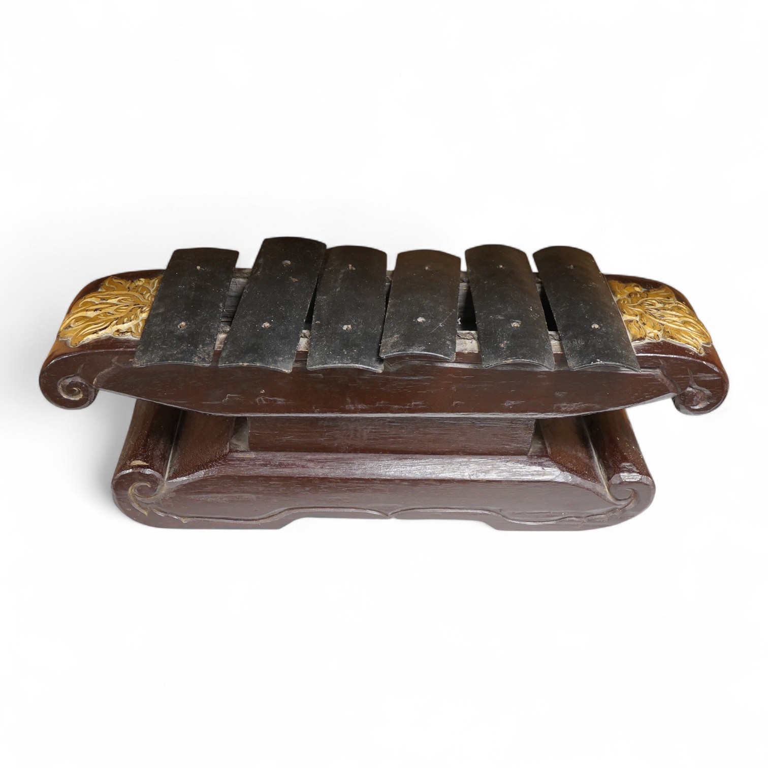 A carved and gilt Balinese Gamelan, 60cm